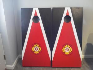 corn hole hagning around the fire house